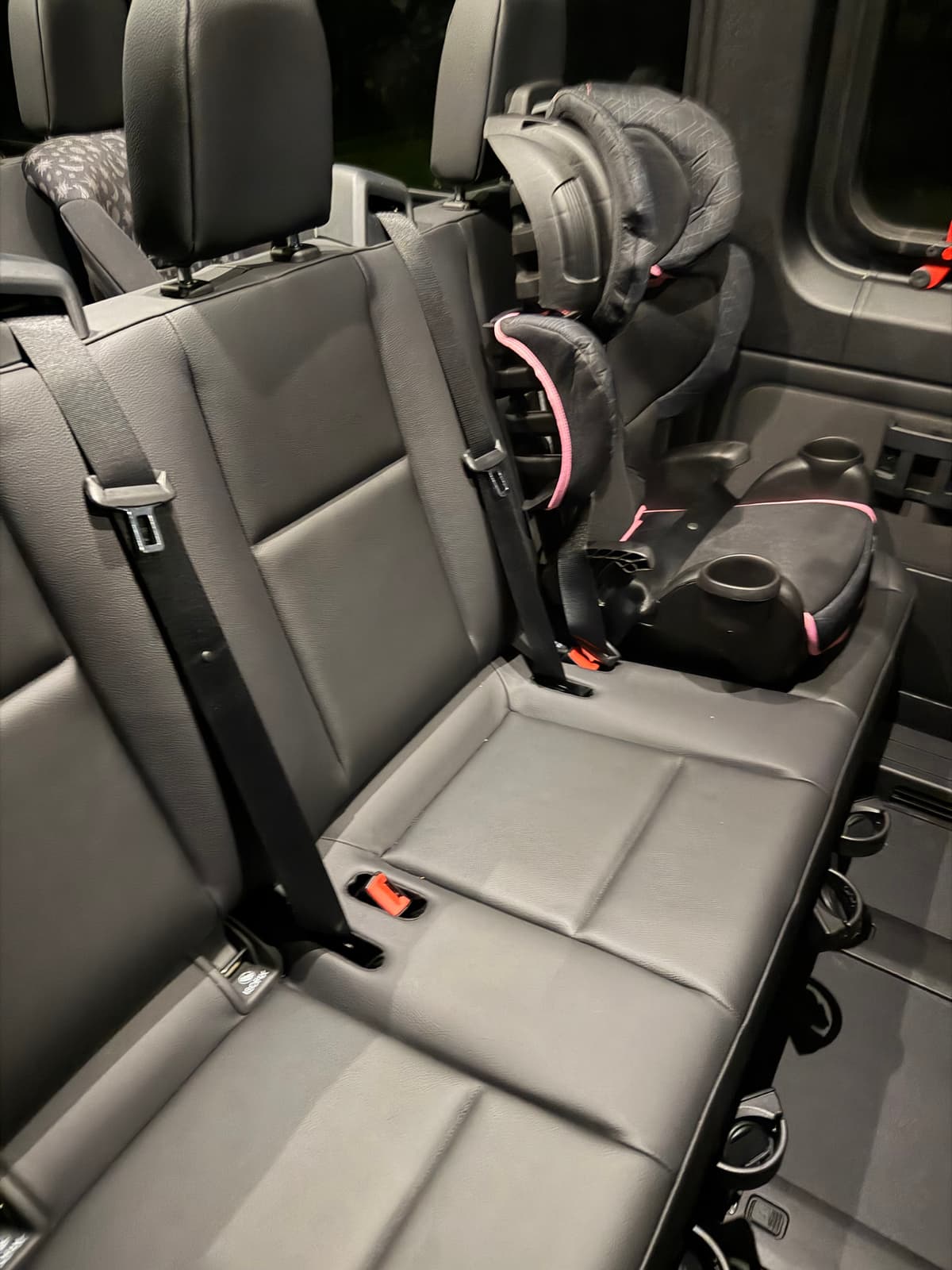 Child safety seat securely installed for Orlando Airport to Disney ride